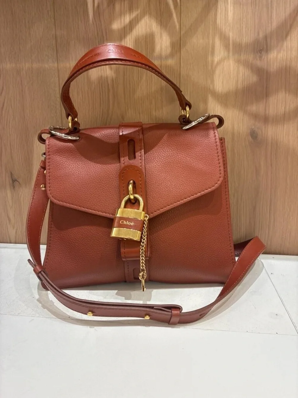 Brown Leather Top-Handle Satchel with Gold Padlock